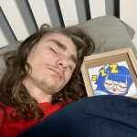 Man sleeping with framed picture