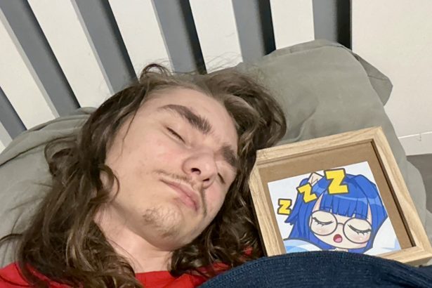 Man sleeping with framed picture