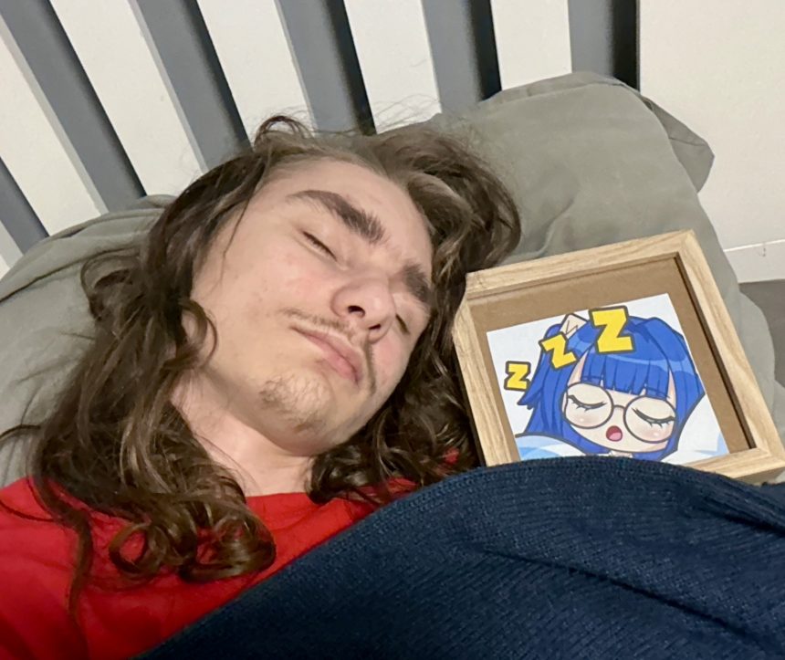 Man sleeping with framed picture
